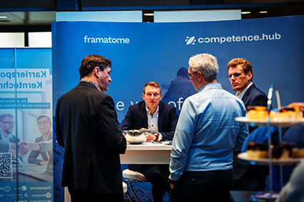 Felix Moellerke and Dr. Thomas Mull from ANF Framatome GmbH present the nuclear e-learning platform competence-hub at their exhibition booth during binding.energy