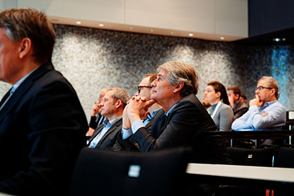 Engaged audience listening attentively to expert talks on topics such as fusion-fission synergies, digitalisation in nuclear, HALEU fuels, and AI-driven innovation at the binding.energy conference