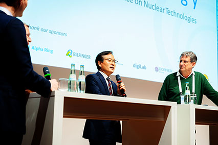 Fusion leaders Dr. Yeong-Kook Oh (Korean Institute of Fusion Energy) and Dr. Alain Becoulet (ITER) engage in discussion on the main stage at binding.energy, exploring how to scale nuclear technologies from research to real-world implementation