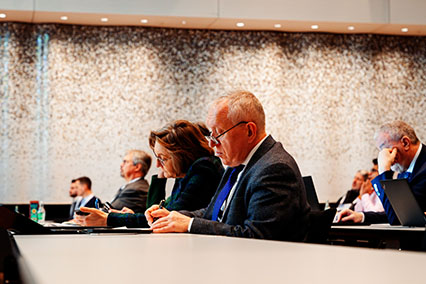 IAEA Director Aline Des Cloizeaux and other nuclear experts taking notes during a presentation at the binding.energy fusion and fission conference in Aachen