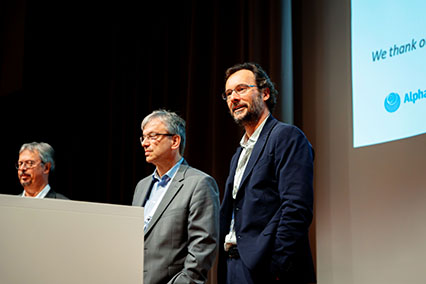 Richard Kembleton (Gauss Fusion) smiling during fusion technology panel at binding.energy, alongside Prof. Dr. Markus Roth and Prof. Dr. Frank Jenko