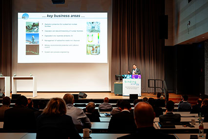 Dr. Jörg Kaulard, Managing Director of Brenk Systemplanung, presenting his company during a sponsor pitch on the main stage at binding.energy nuclear technologies conference