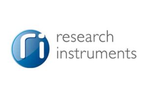 Research Instruments exhibition booth showcasing advanced accelerator components and nuclear instrumentation at an international energy technology event.